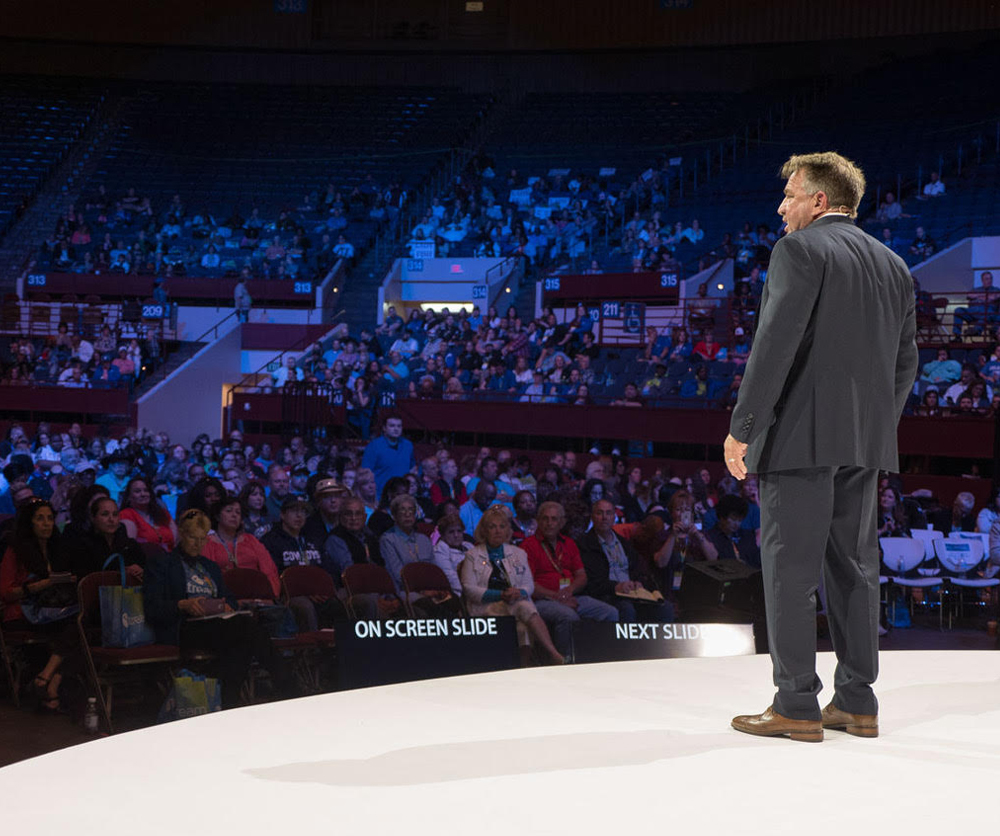 Photo of Presley Swagerty keynote speaker in front of large audience